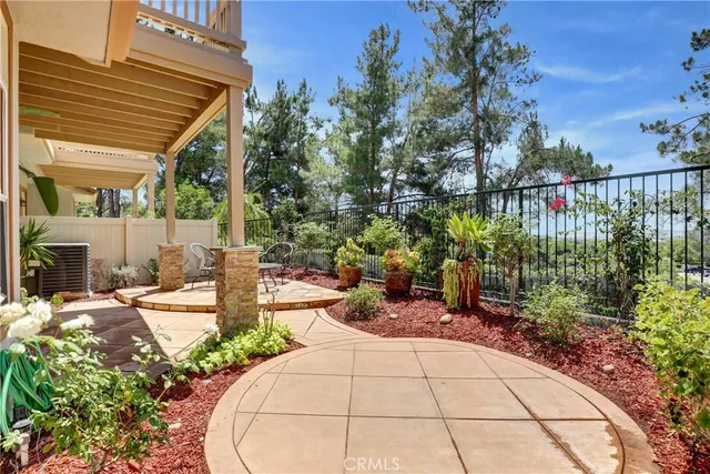 a view of a backyard with sitting area