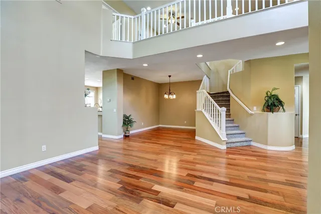 a view of an entryway with wooden floor