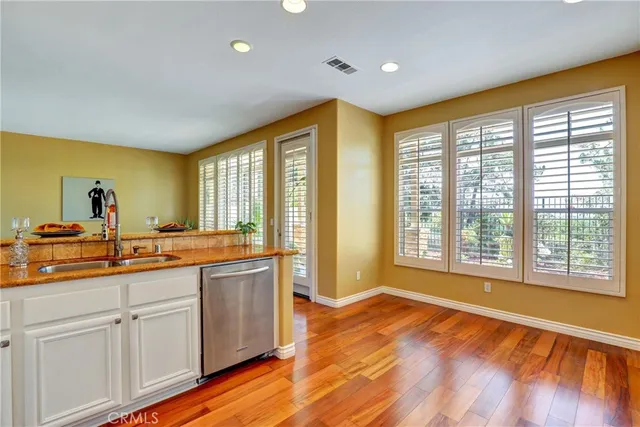 a view of a large kitchen with a large window