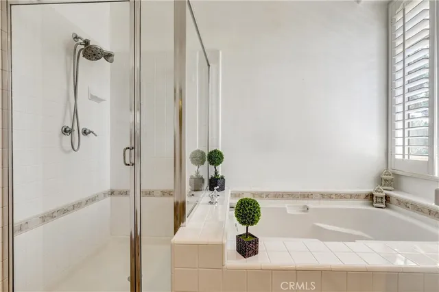 a bath tub sitting next to a white sink