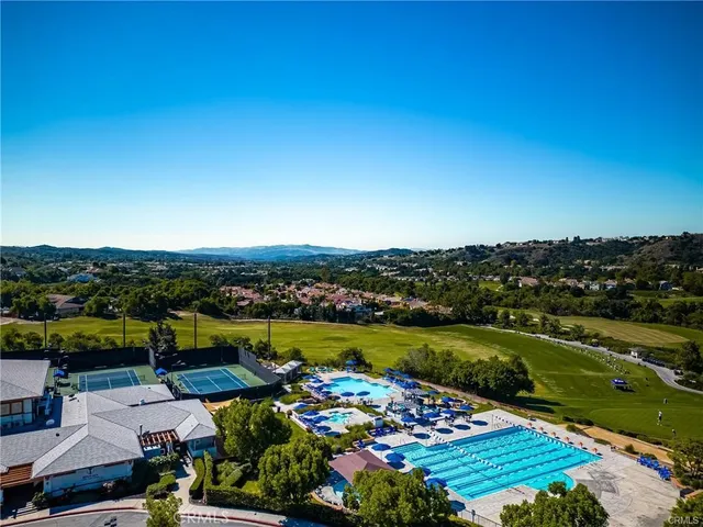 a view of a swimming pool with a lounge chairs