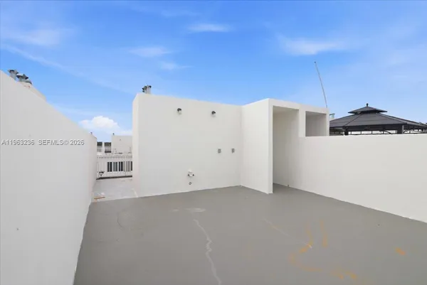 a view of a kitchen with a fridge