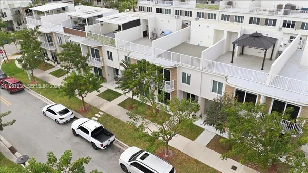an aerial view of residential house with parking