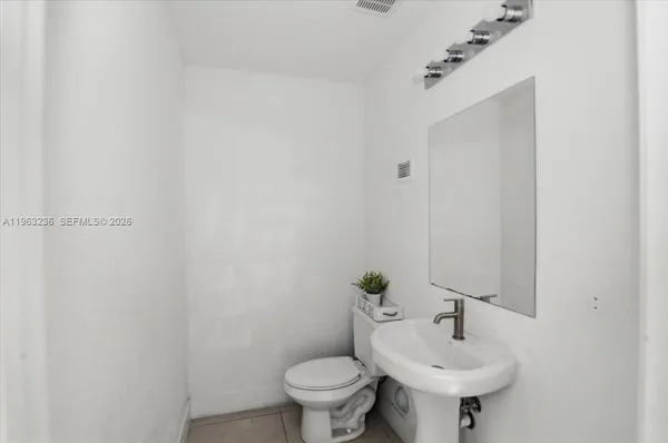 a bathroom with a sink and toilet