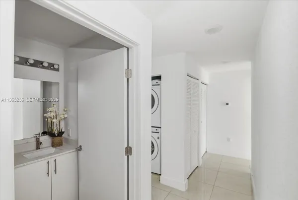 a bathroom with a sink a mirror and a shower