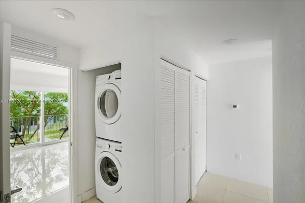 a utility room with sink dryer and washer