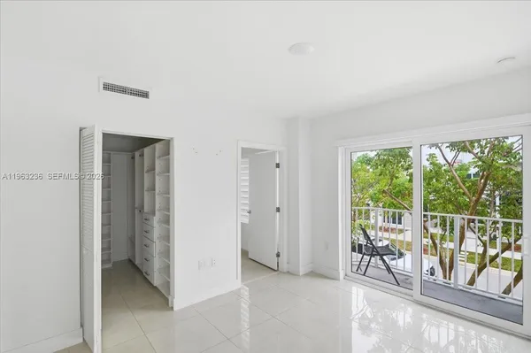 a view of an empty room and window