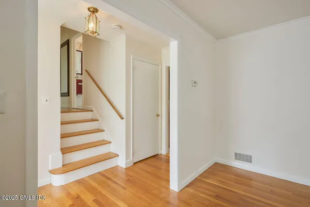 a view of entryway with wooden floor