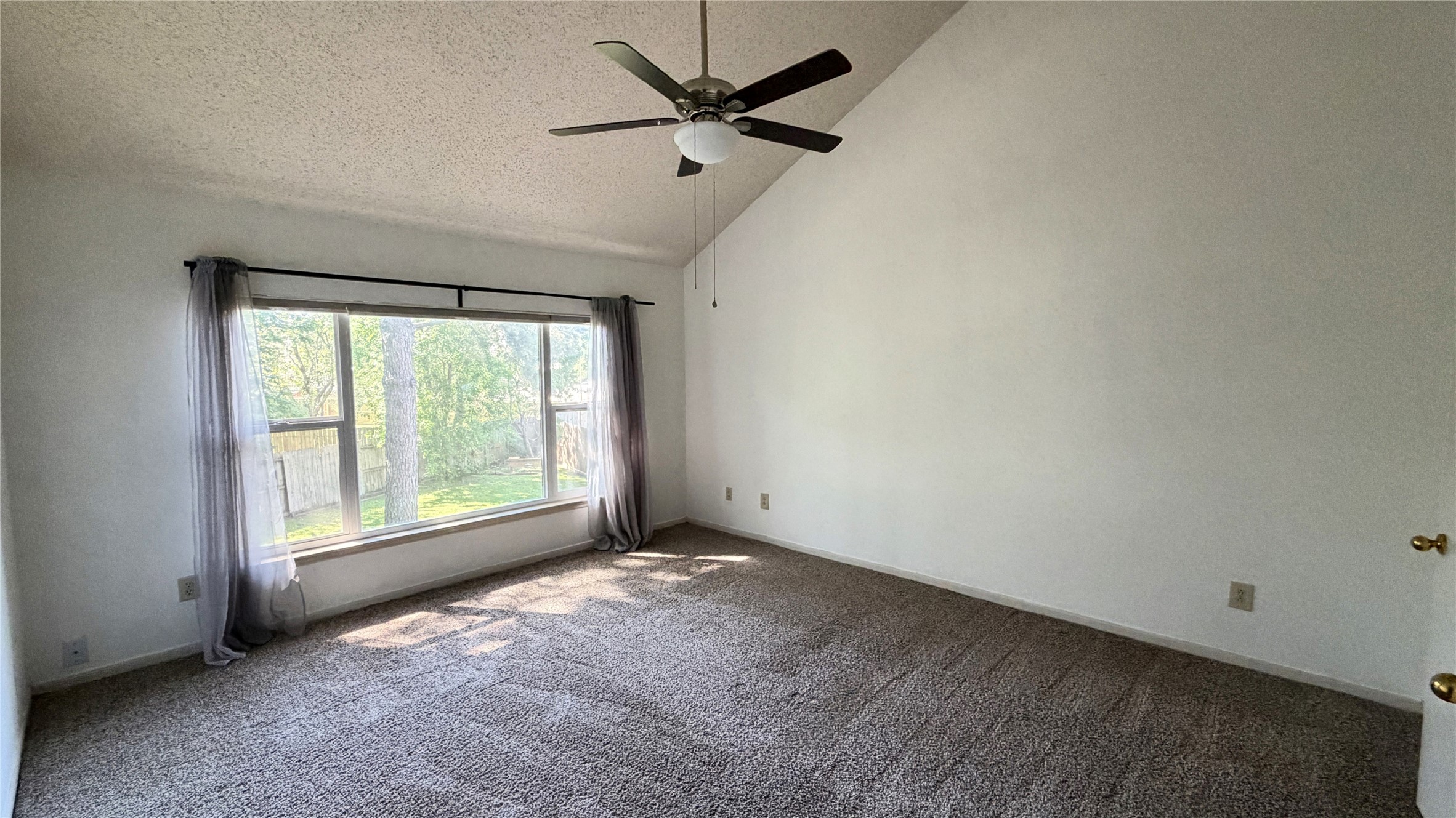 7771 Springville Drive Houston, TX 77095 - Photo 9 of 13 Spacious primary bedroom filled with natural light.