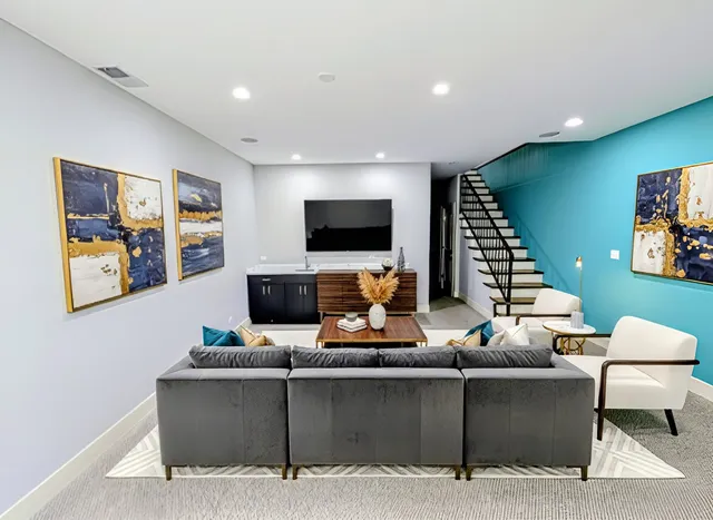 a living room with furniture and a flat screen tv