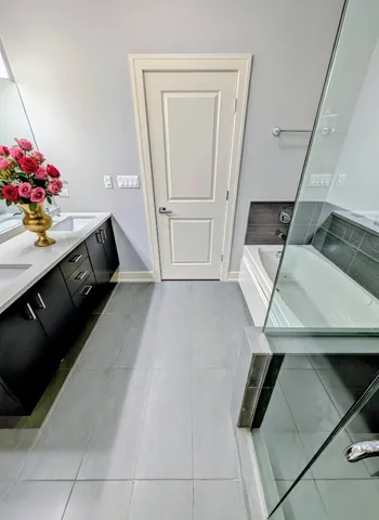 a view of a hallway to room with wooden floor and stairs