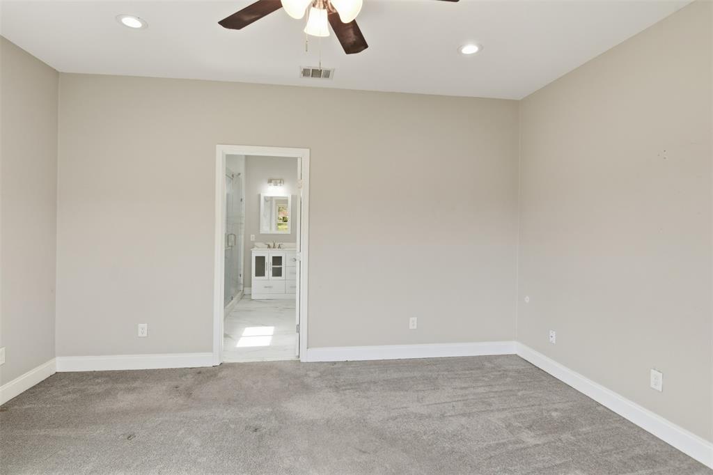 2204 Albert Broadfoot Street Bonham, TX 75418 - Photo 14 of 39 an empty room with chandelier fan and windows