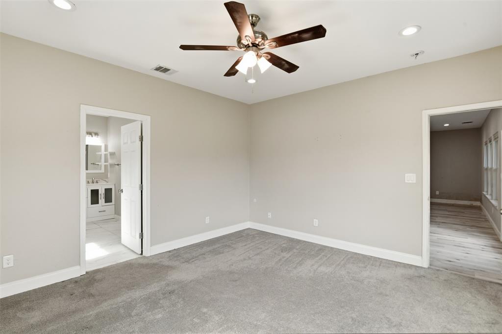 2204 Albert Broadfoot Street Bonham, TX 75418 - Photo 18 of 39 an empty room with closet and a chandelier fan