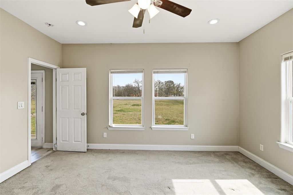 2204 Albert Broadfoot Street Bonham, TX 75418 - Photo 19 of 39 an empty room with a window