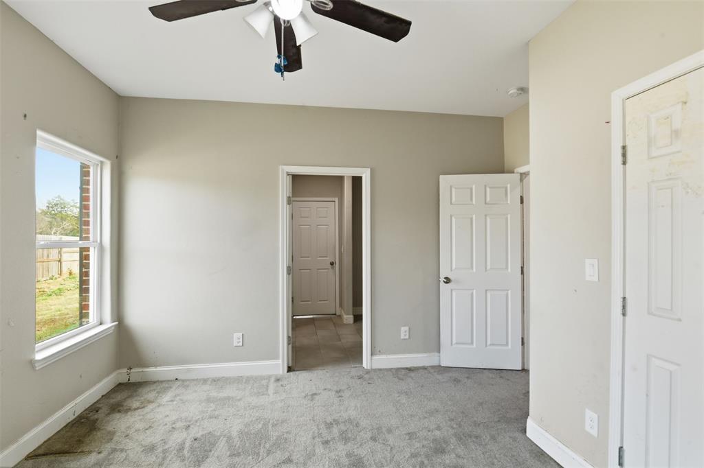 2204 Albert Broadfoot Street Bonham, TX 75418 - Photo 20 of 39 a view of an empty room with window and closet area