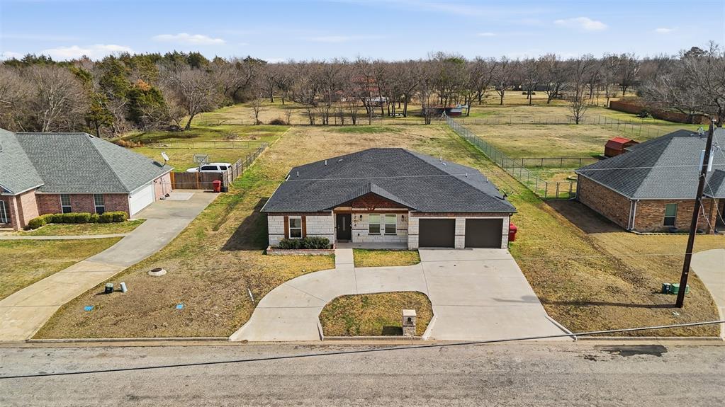 2204 Albert Broadfoot Street Bonham, TX 75418 - Photo 2 of 39 a view of a house with pool and a yard