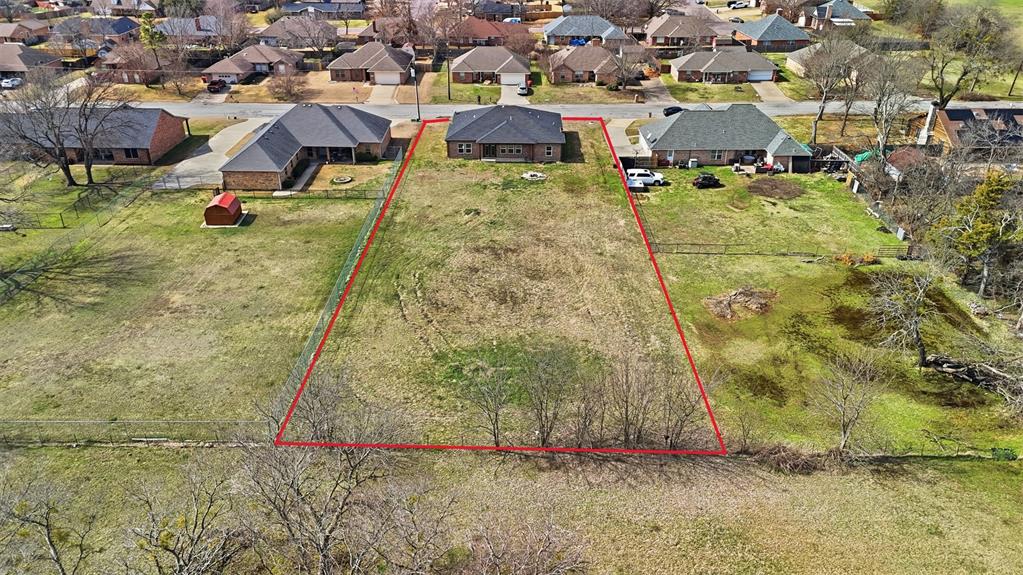2204 Albert Broadfoot Street Bonham, TX 75418 - Photo 32 of 39 an aerial view of residential houses with yard