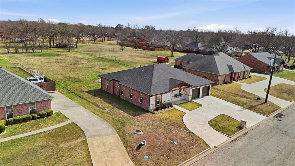 2204 Albert Broadfoot Street Bonham, TX 75418 - Photo 38 of 39 a view of a house with a big yard