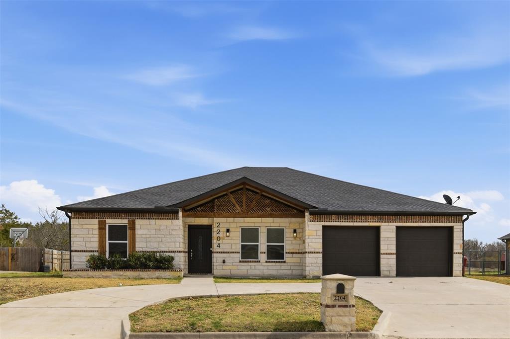 2204 Albert Broadfoot Street Bonham, TX 75418 - Photo 4 of 39 a front view of a house with a yard