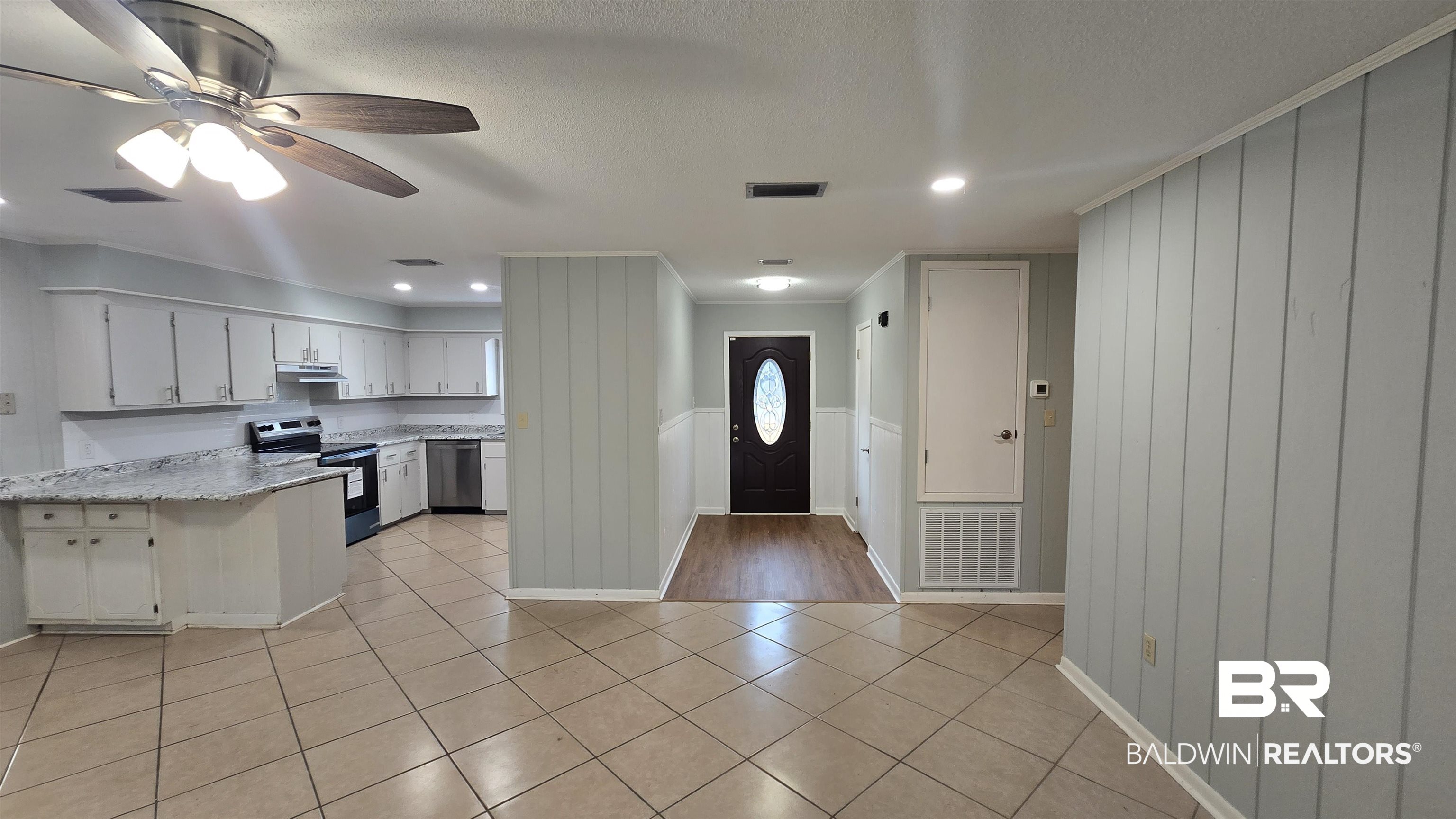 615 East Pedigo Avenue Foley, AL 36535 - Photo 22 of 31 Kitchen featuring white cabinets, stainless steel appliances, a ceiling fan, recessed lighting, and a peninsula