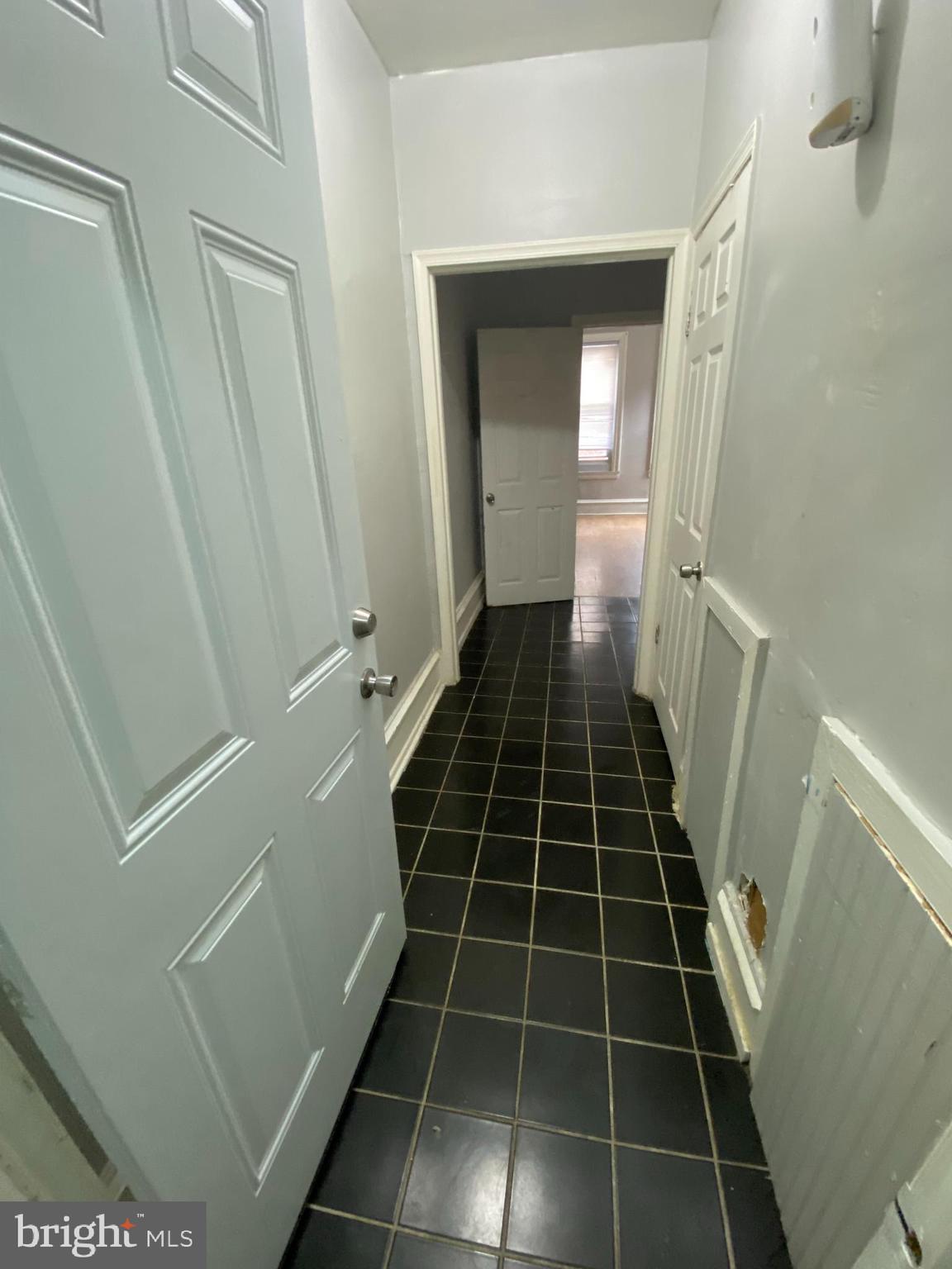 a view of a black and white checkered floor