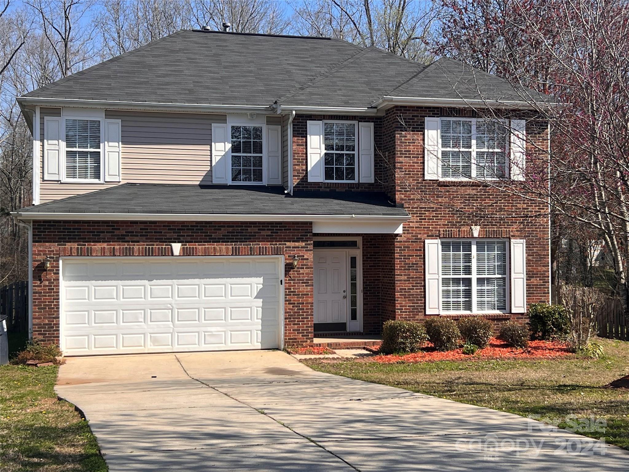 1022 Breakmaker Lane Indian Trail, NC 28079 - Photo 1 of 20 a front view of a house with a yard and garage