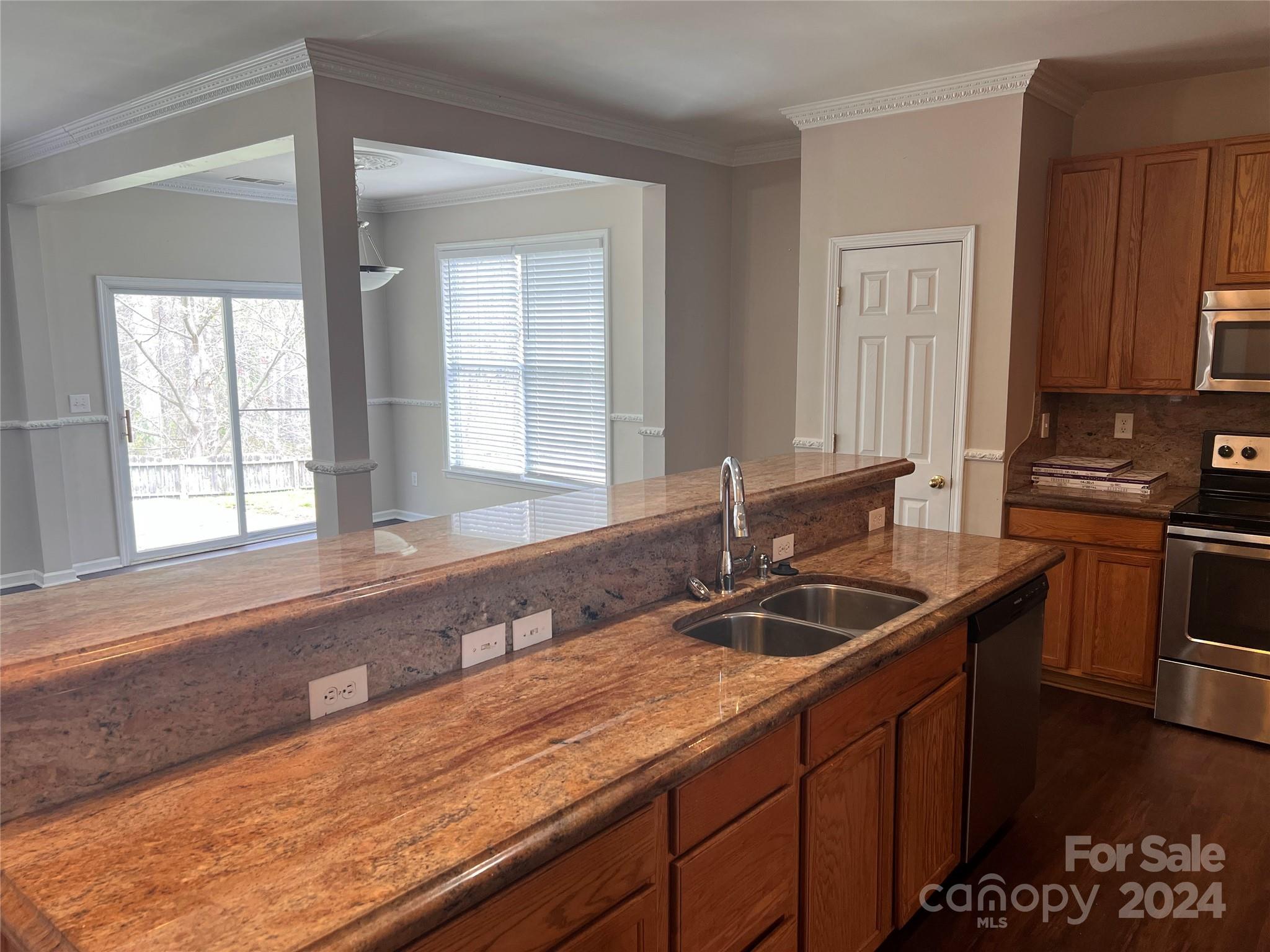 1022 Breakmaker Lane Indian Trail, NC 28079 - Photo 6 of 20 a kitchen with a sink and cabinets
