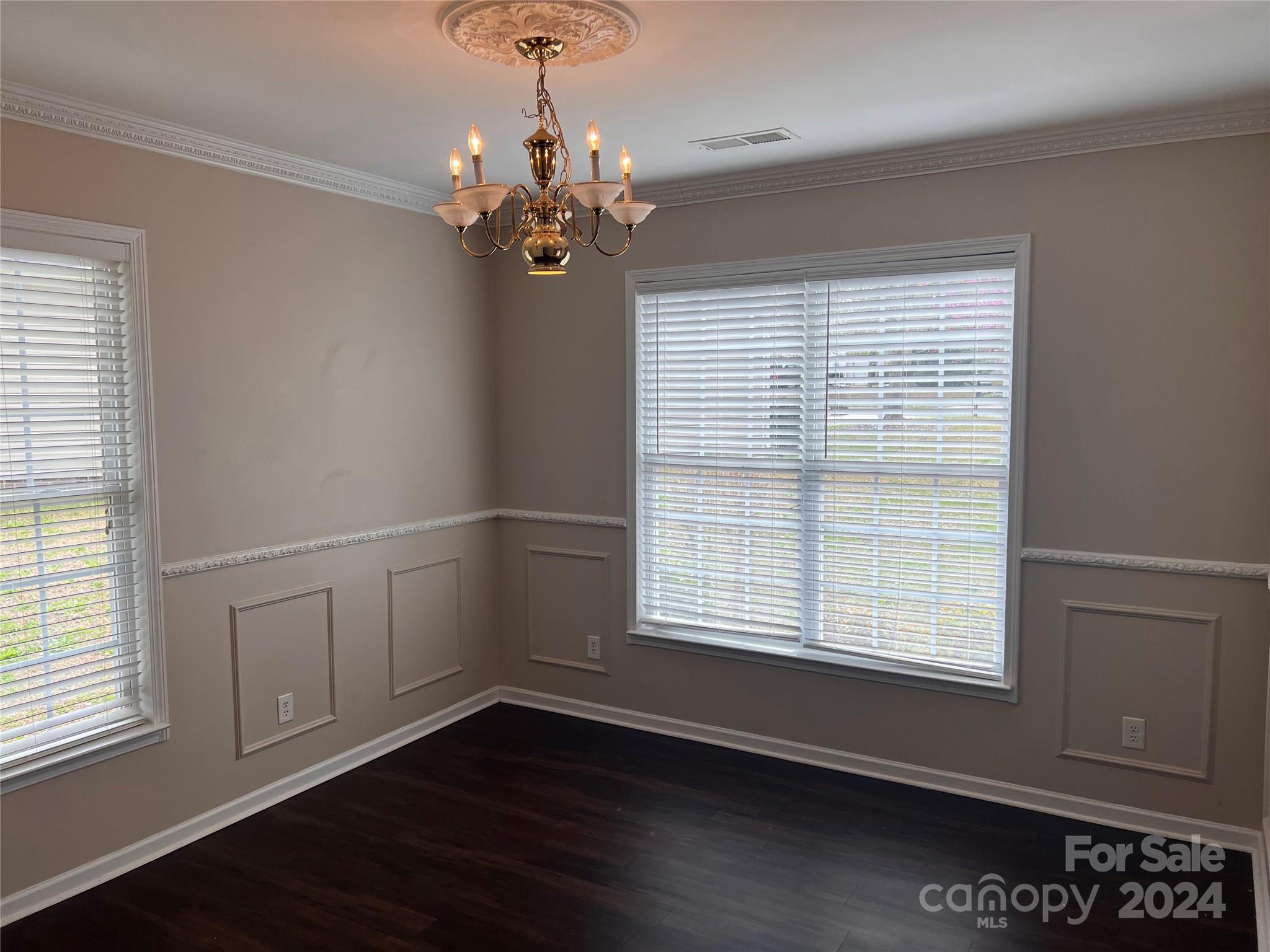 1022 Breakmaker Lane Indian Trail, NC 28079 - Photo 7 of 20 a view of an empty room with a window and wooden floor