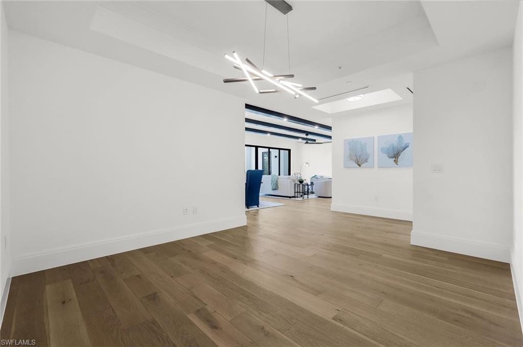 1130 3rd Avenue South, Unit 211 Naples, FL 34102 - Photo 20 of 33 a view of empty room with wooden floor