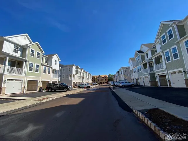 a city street lined with buildings and cars
