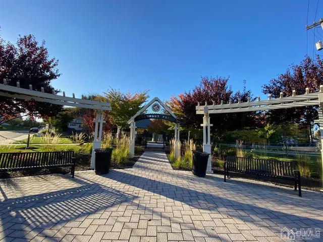 a view of a chairs and tables in patio and a fountain