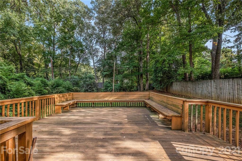 4211 Murrayhill Road Charlotte, NC 28209 - Photo 17 of 18 a view of deck with two chairs and wooden fence