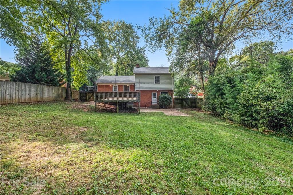 4211 Murrayhill Road Charlotte, NC 28209 - Photo 7 of 18 a view of a house with backyard and a tree