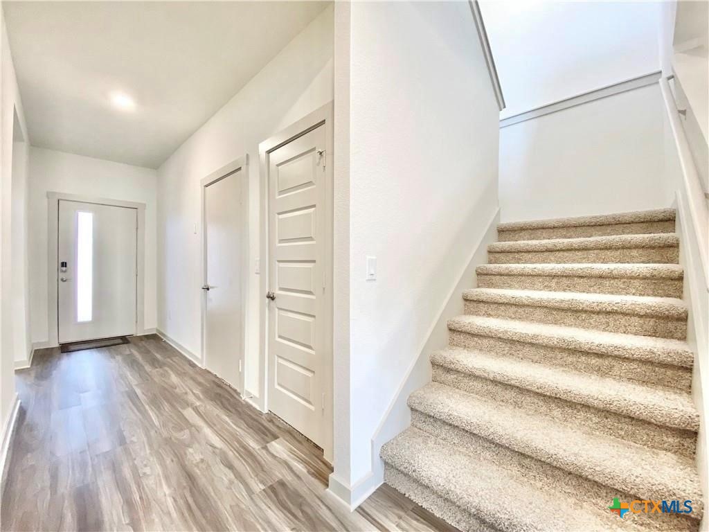 100 Geminiflora Bend Leander, TX 78641 - Photo 17 of 38 a view of an entryway with wooden floor
