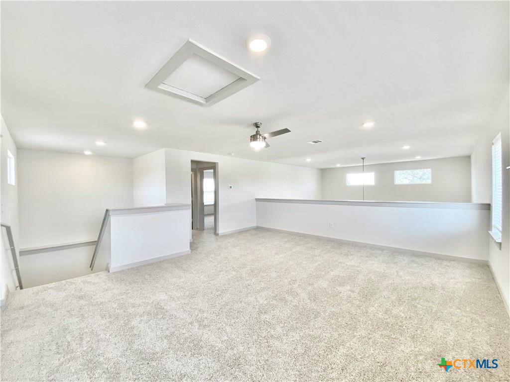 100 Geminiflora Bend Leander, TX 78641 - Photo 18 of 38 an empty room with a empty space and windows