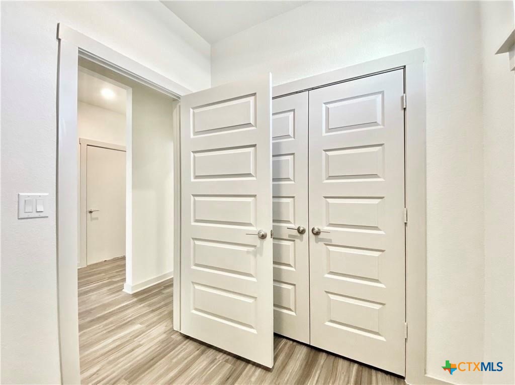 100 Geminiflora Bend Leander, TX 78641 - Photo 20 of 38 a view of walk in closet with empty racks