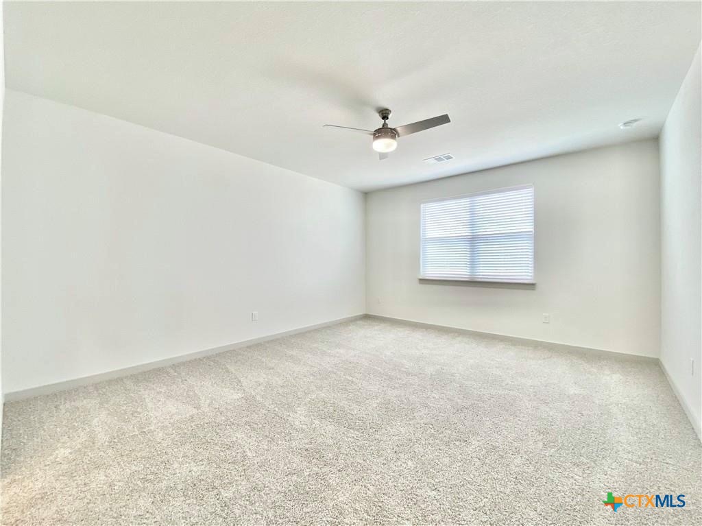 100 Geminiflora Bend Leander, TX 78641 - Photo 27 of 38 an empty room with a empty space and windows