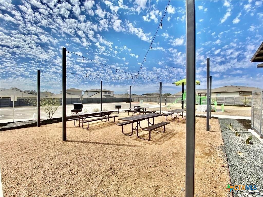 100 Geminiflora Bend Leander, TX 78641 - Photo 37 of 38 a view of a swimming pool with lawn chairs and couches