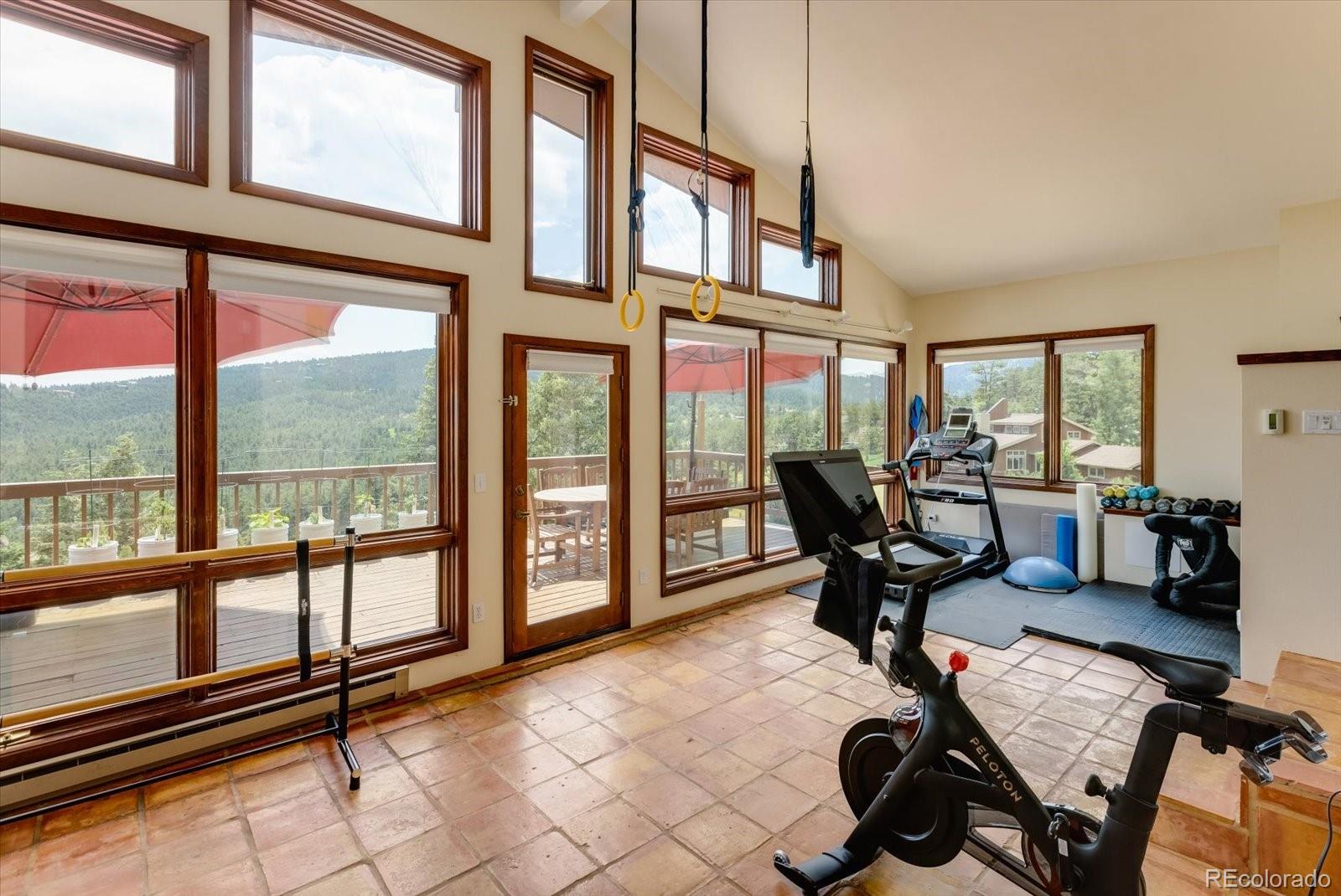 326 Peakview Road Boulder, CO 80302 - Photo 12 of 29 a work room with furniture and large windows