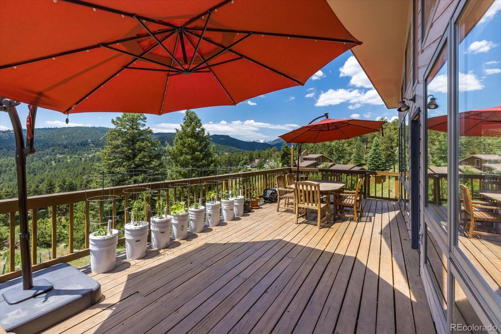 326 Peakview Road Boulder, CO 80302 - Photo 13 of 29 a view of balcony with furniture and umbrella