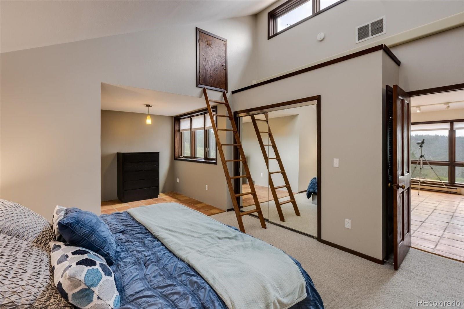 326 Peakview Road Boulder, CO 80302 - Photo 14 of 29 a bedroom with a bed and a mirror