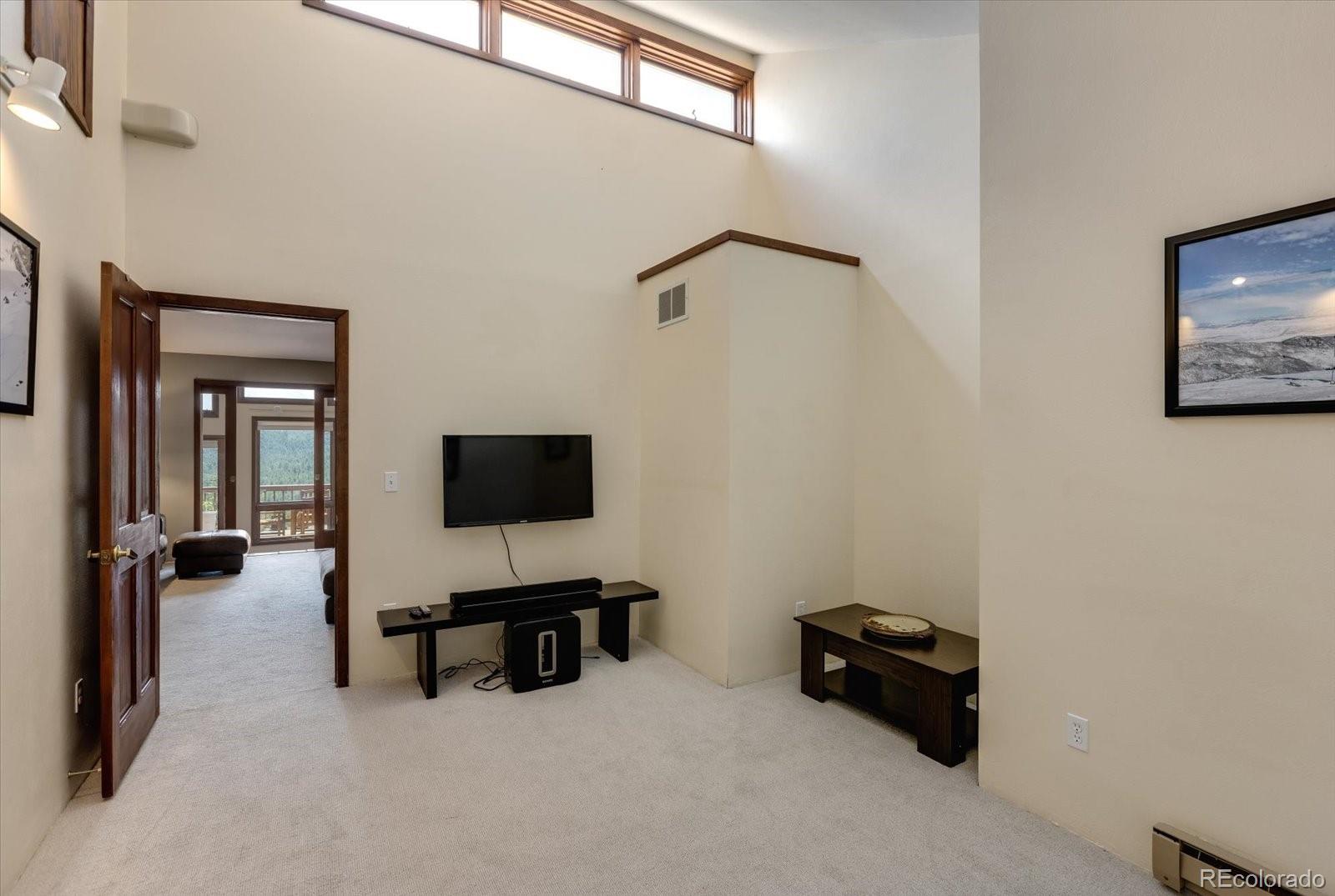 326 Peakview Road Boulder, CO 80302 - Photo 20 of 29 a room with furniture and a flat screen tv