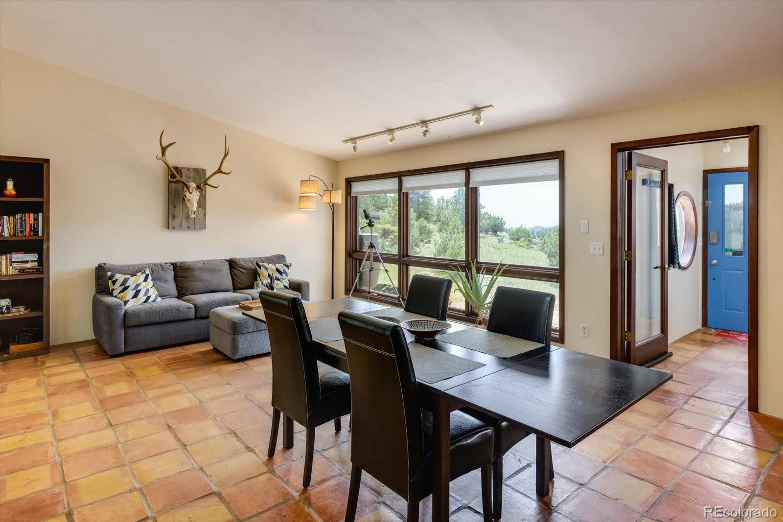 326 Peakview Road Boulder, CO 80302 - Photo 3 of 29 a living room with furniture and large windows