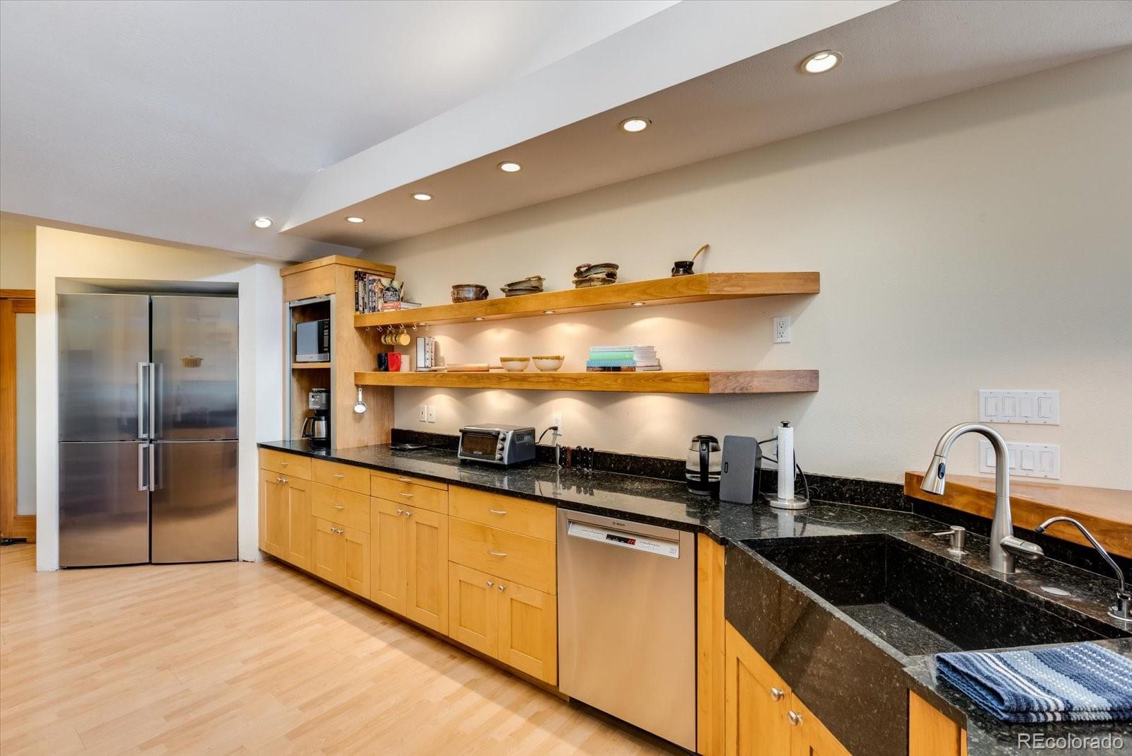 326 Peakview Road Boulder, CO 80302 - Photo 7 of 29 a kitchen with granite countertop a sink and cabinets