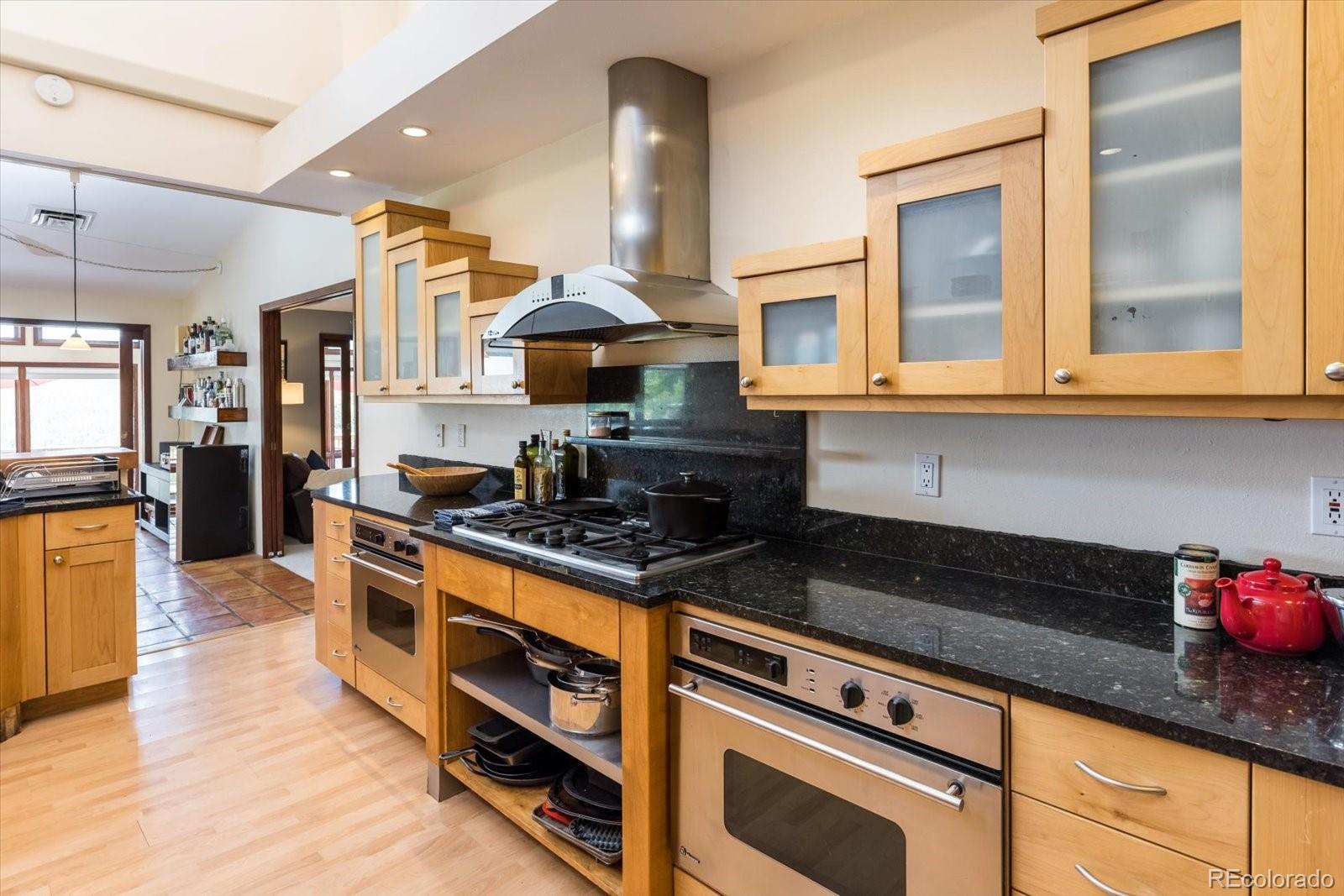 326 Peakview Road Boulder, CO 80302 - Photo 9 of 29 a kitchen with stainless steel appliances granite countertop a stove and a sink