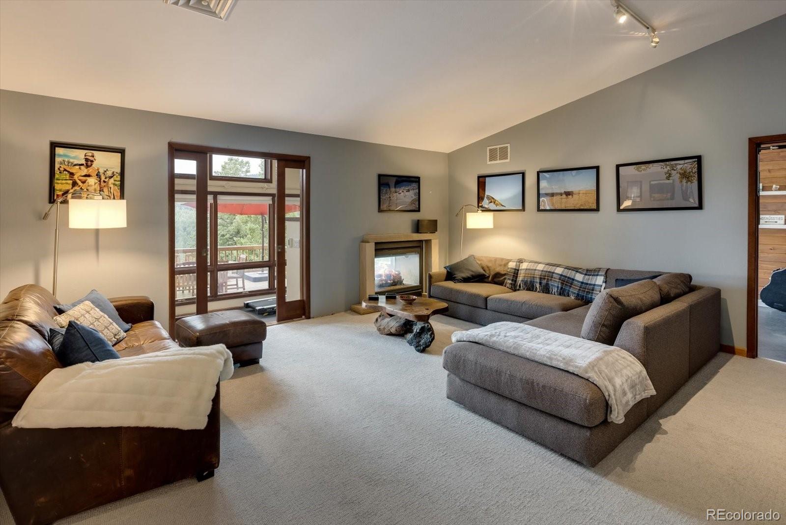 326 Peakview Road Boulder, CO 80302 - Photo 10 of 29 a living room with furniture and a window