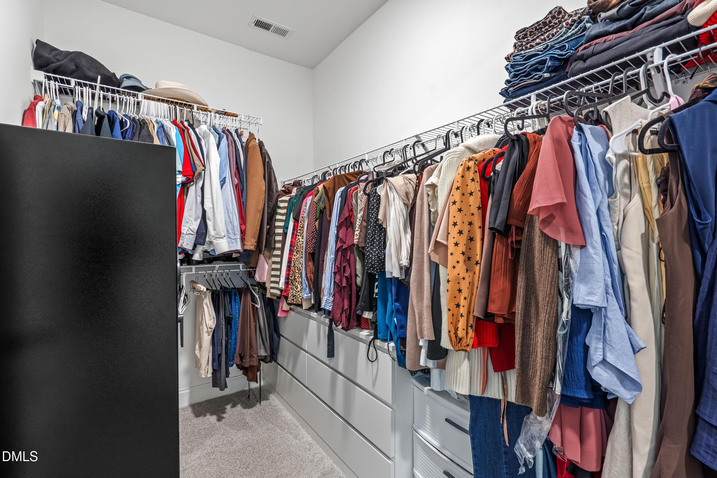 403 Airedale Trail Garner, NC 27529 - Photo 29 of 48 a view of walk in closet with clothes