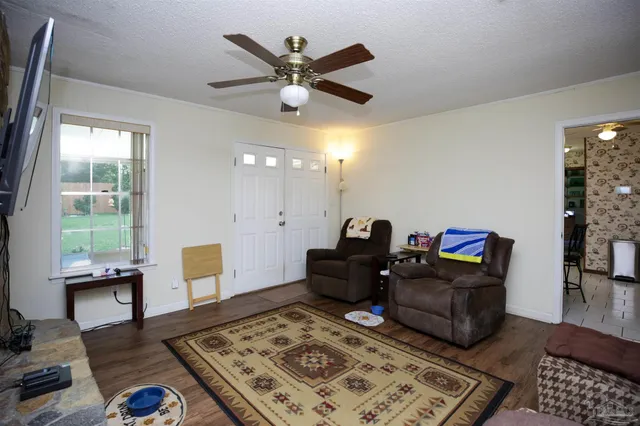 a living room with furniture and a window