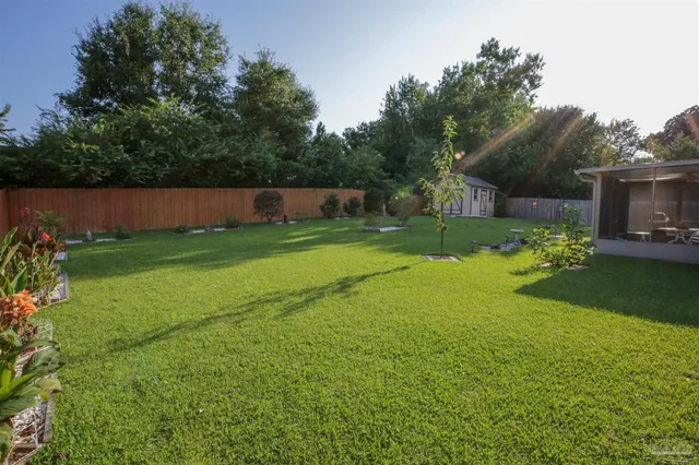 a view of a house with a big yard