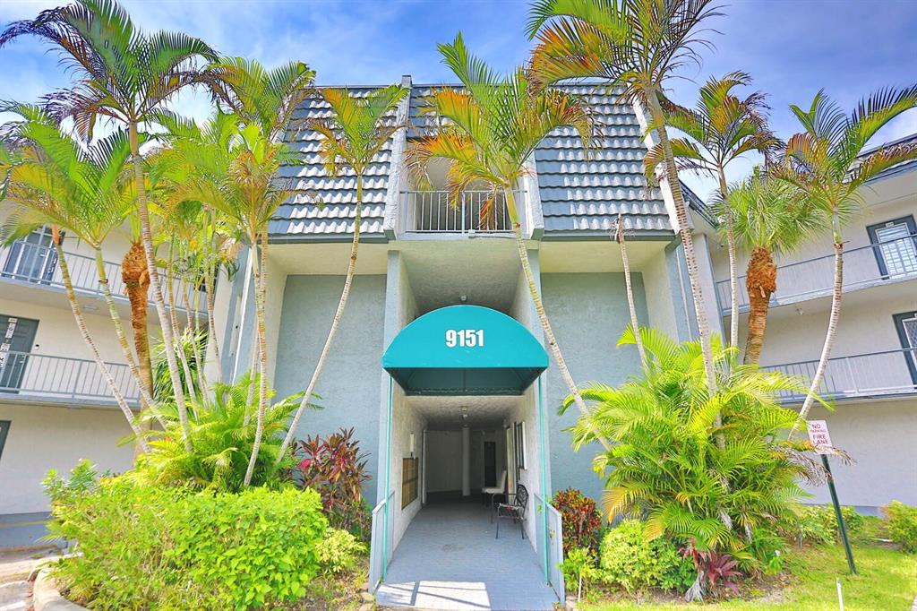 9151 Lime Bay Boulevard, Unit 310 Tamarac, FL 33321 - Photo 1 of 30 a house view with a garden space